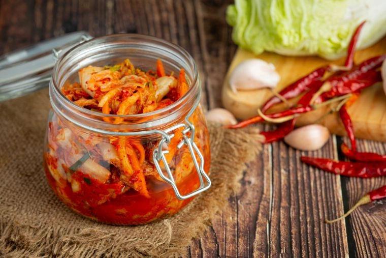 Kimchi in glass jar for gut health benefits.
